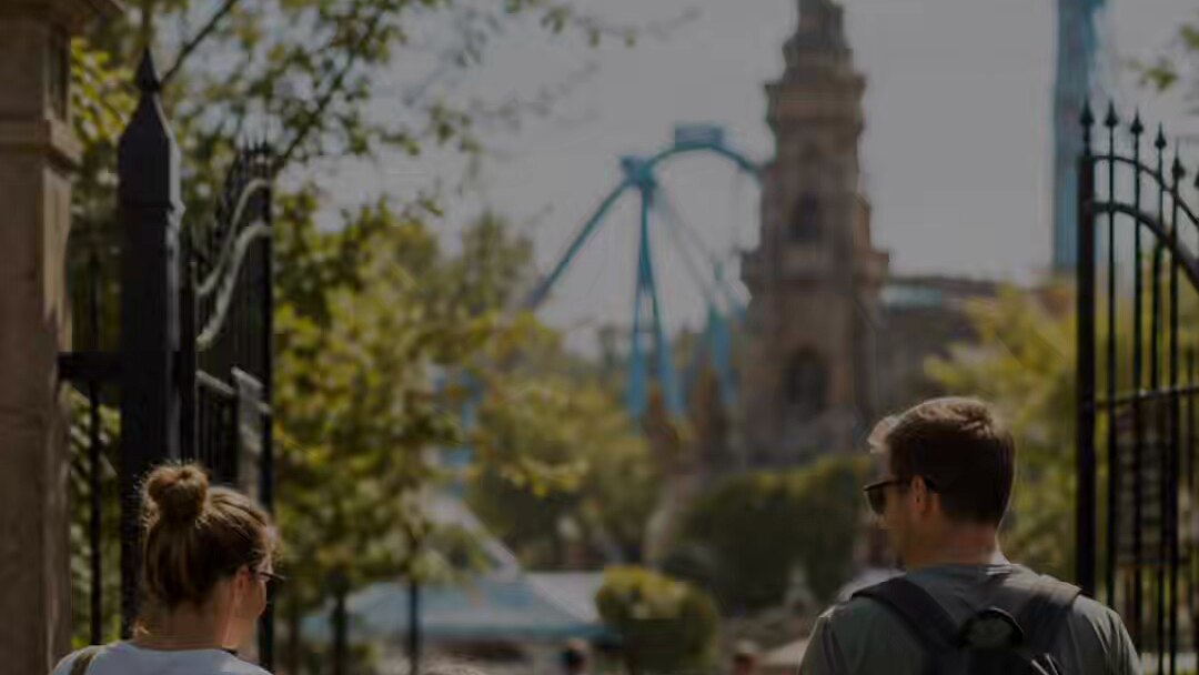 A family walking into a theme park